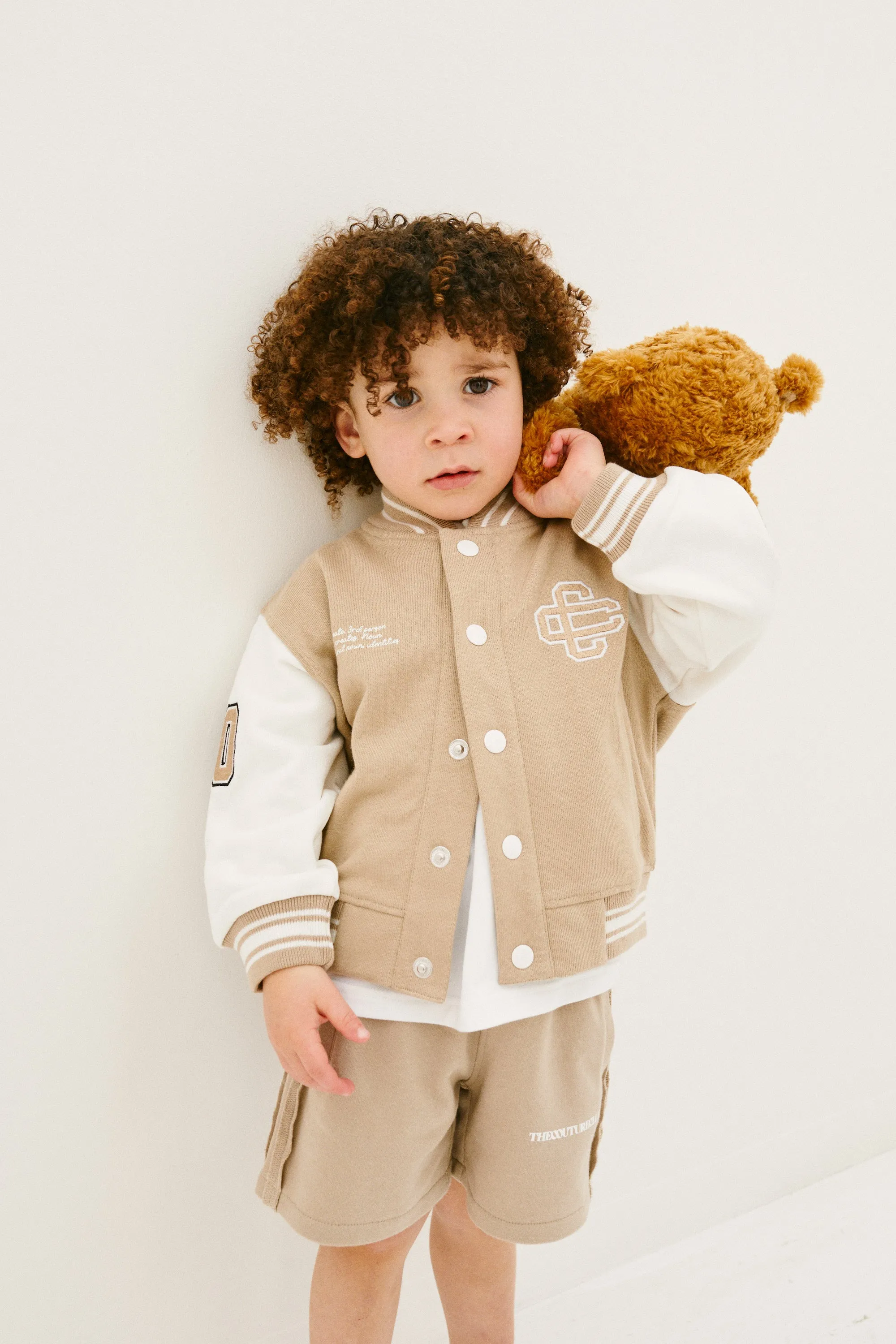 KIDS EMBLEM VARSITY BOMBER JACKET - BEIGE