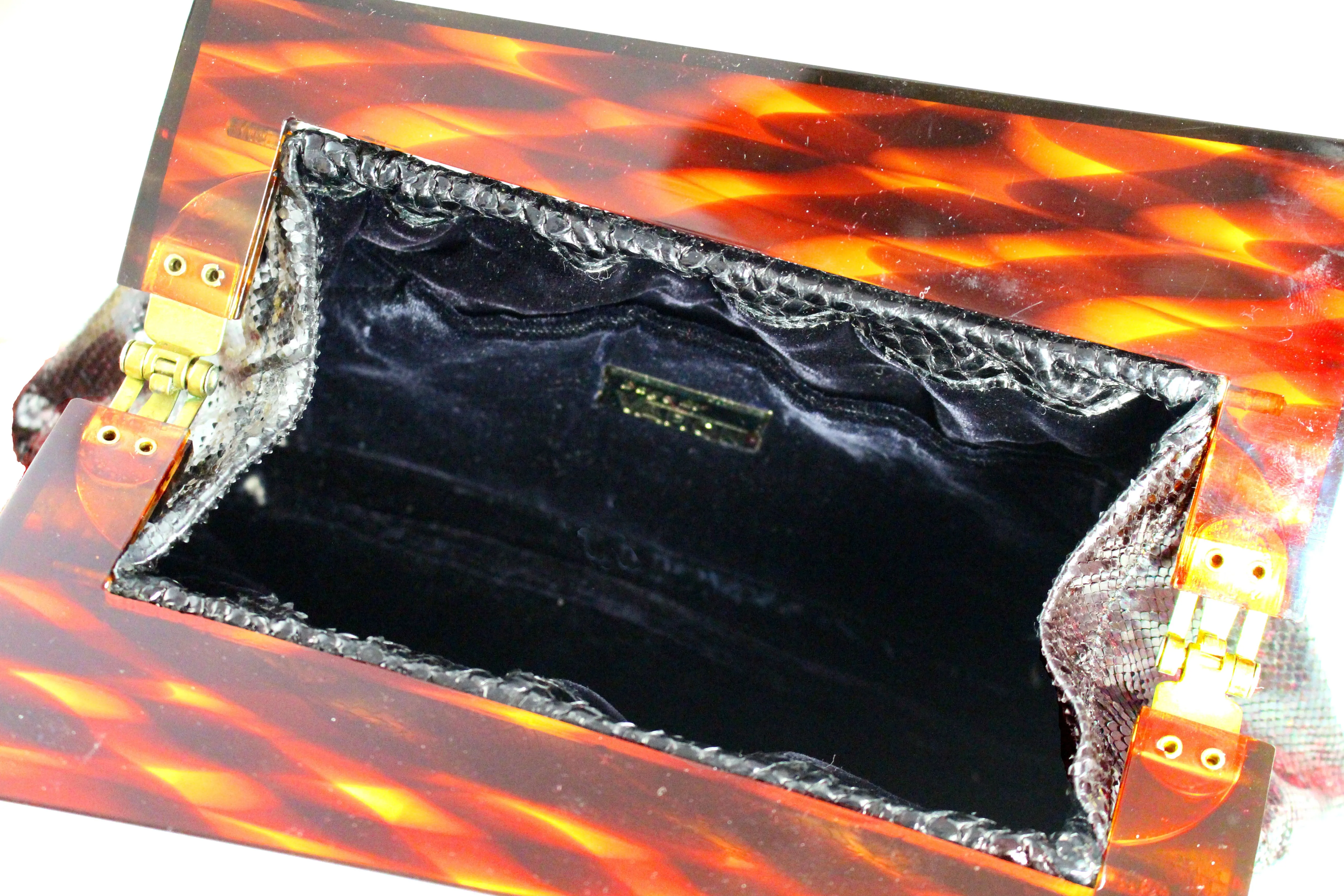 VARON black snake clutch with lucite frame